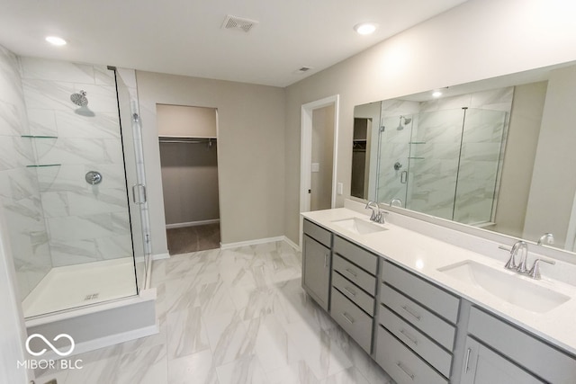 bathroom with vanity and an enclosed shower