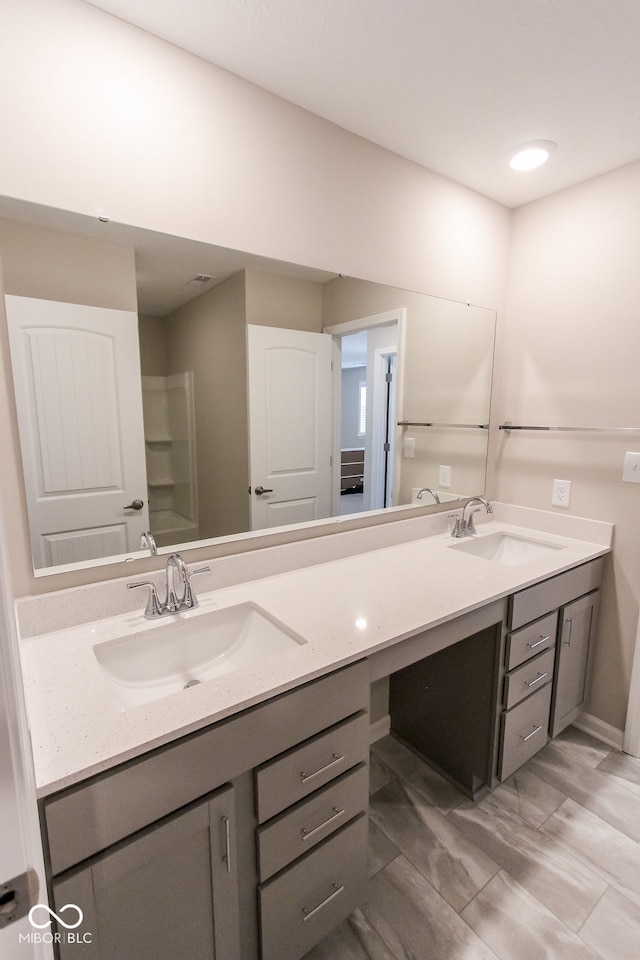 bathroom featuring wood-type flooring and vanity