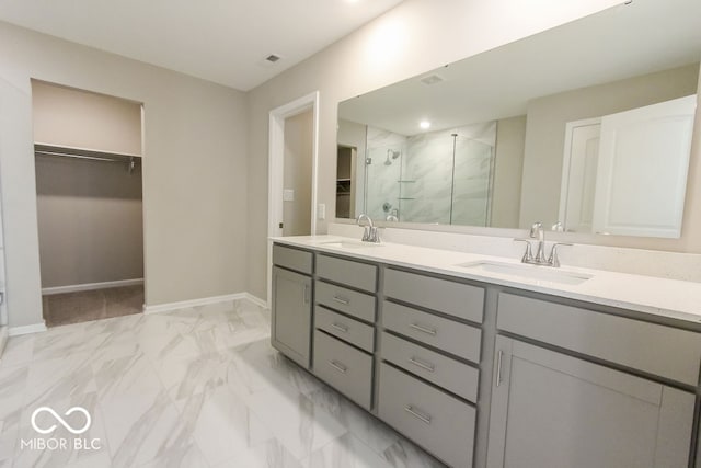 bathroom with vanity and an enclosed shower