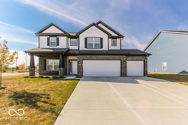 view of front of house featuring a front yard and a garage