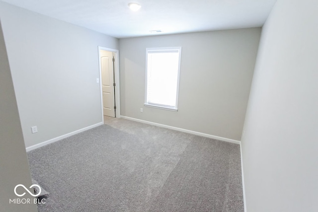 empty room featuring carpet floors