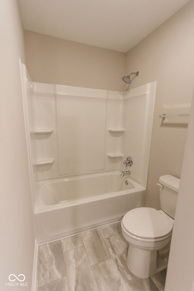 bathroom with toilet and tub / shower combination