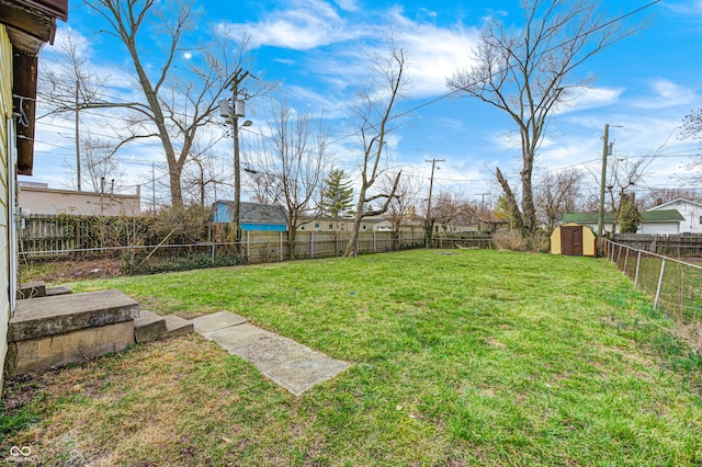 120 Hugo St, Indianapolis, IN 46229 - view of yard with a fenced backyard, a storage unit, and an outdoor structure