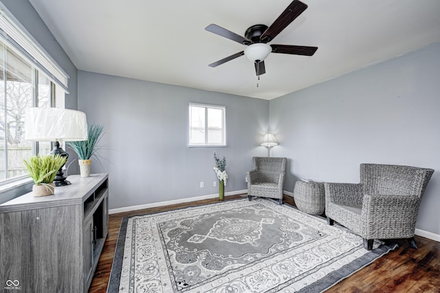 120 Hugo St, Indianapolis, IN 46229 - sitting room featuring ceiling fan, baseboards, and dark wood-style floors
