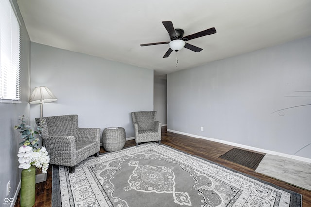 120 Hugo St, Indianapolis, IN 46229 - living area featuring wood finished floors, baseboards, and ceiling fan