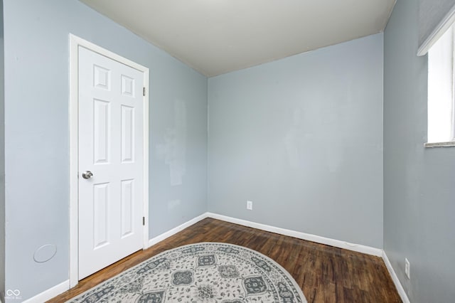 120 Hugo St, Indianapolis, IN 46229 - spare room with dark wood-style floors and baseboards