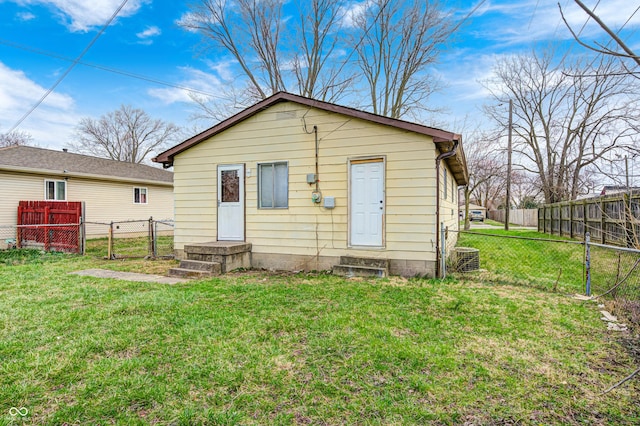 120 Hugo St, Indianapolis, IN 46229 - back of property featuring fence, a lawn, and a gate