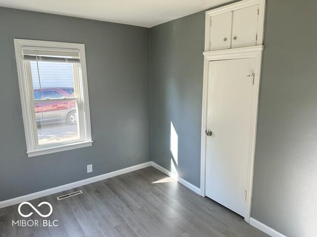 spare room with light hardwood / wood-style floors