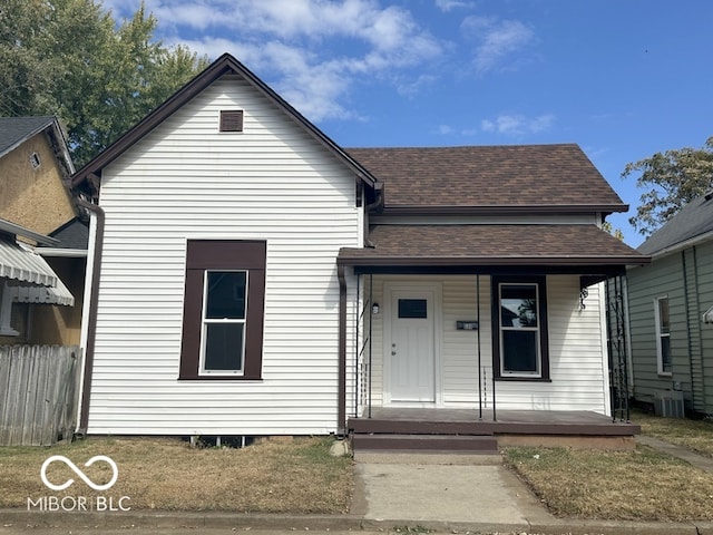 bungalow-style home featuring a porch and central AC unit