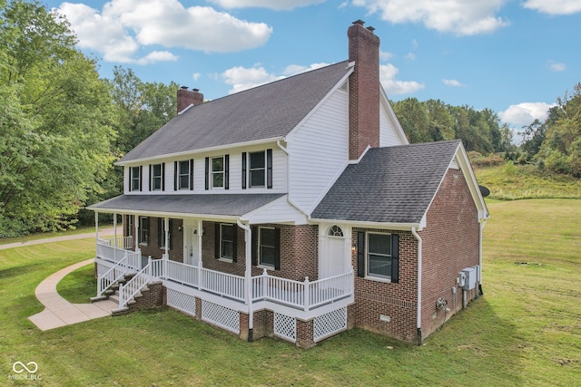 view of front of home with a porch and a front lawn