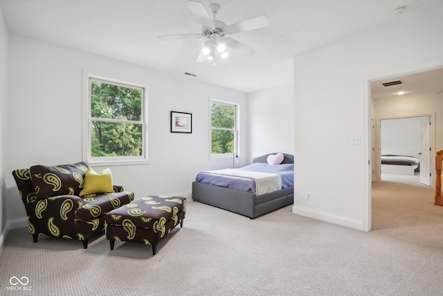 bedroom featuring light carpet and ceiling fan