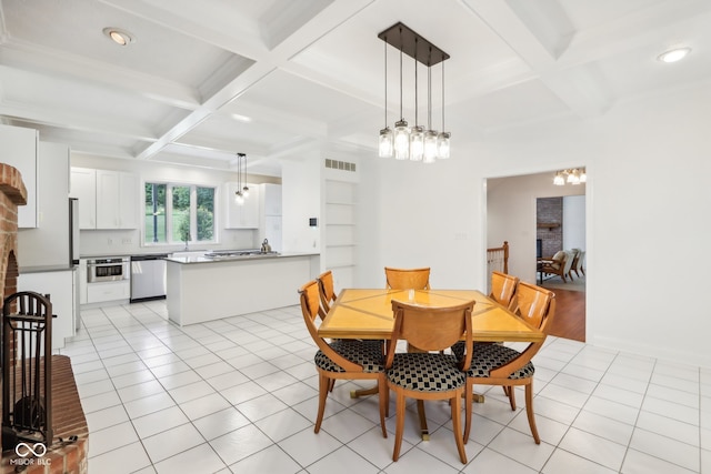 dining room featuring beam ceiling, light tile patterned floors, coffered ceiling, and a fireplace