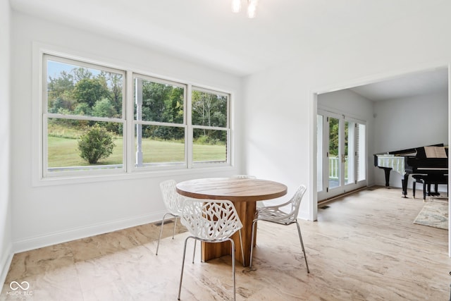 dining space with plenty of natural light