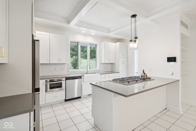 kitchen with stainless steel appliances, white cabinetry, coffered ceiling, and sink