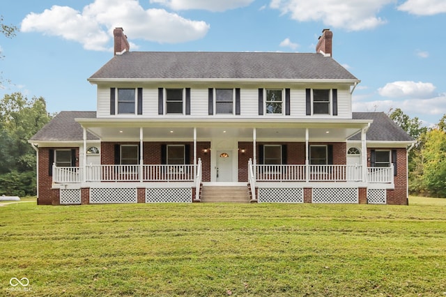 colonial-style house with a front lawn and a porch