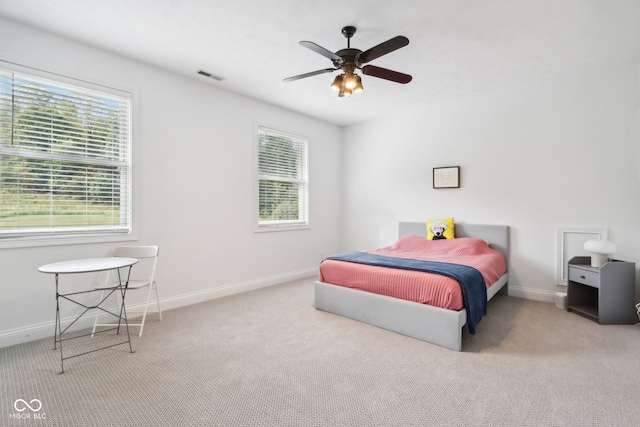 bedroom featuring ceiling fan and light colored carpet