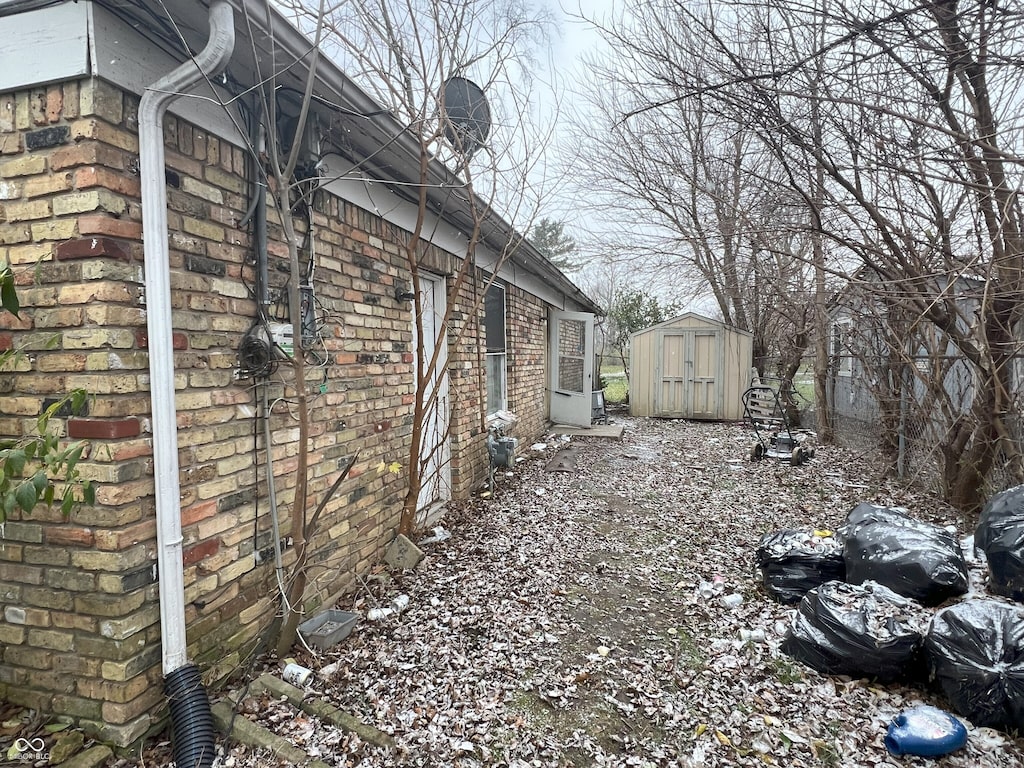 view of property exterior featuring a storage shed