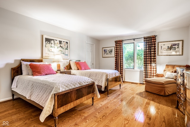 bedroom featuring light wood-type flooring