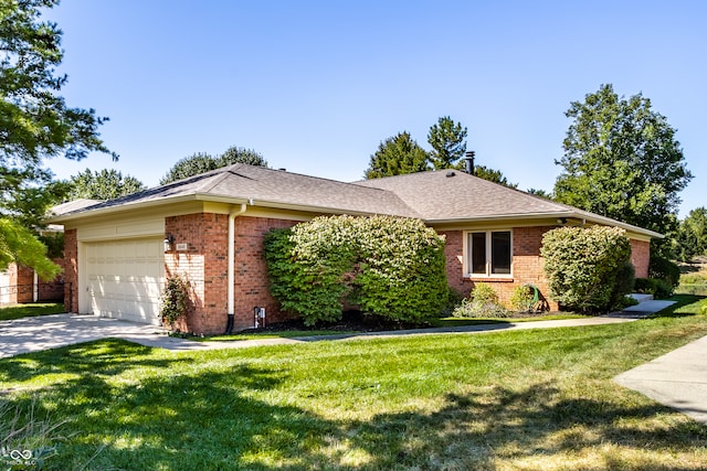 ranch-style home with a front yard and a garage