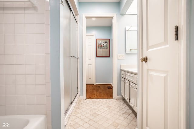 bathroom with independent shower and bath and vanity