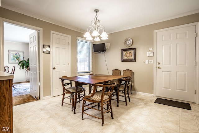 dining space featuring ornamental molding and a chandelier