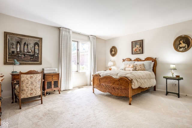 bedroom featuring light colored carpet