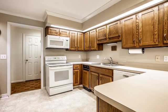 kitchen featuring ornamental molding, white appliances, and sink