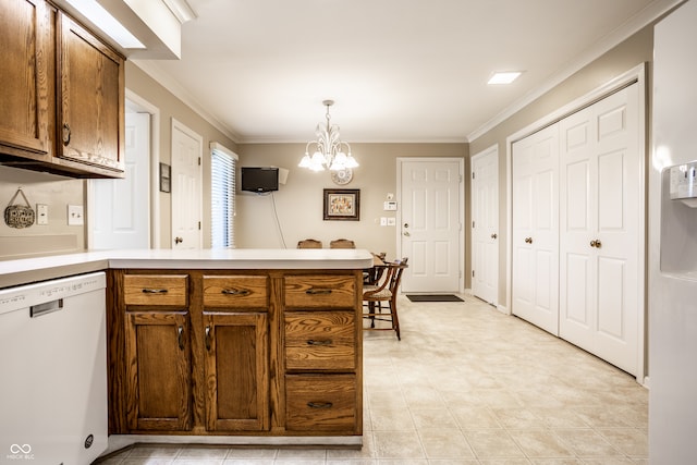 kitchen with white dishwasher, hanging light fixtures, a notable chandelier, and crown molding