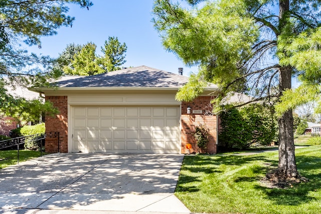 view of front of property with a garage and a front yard