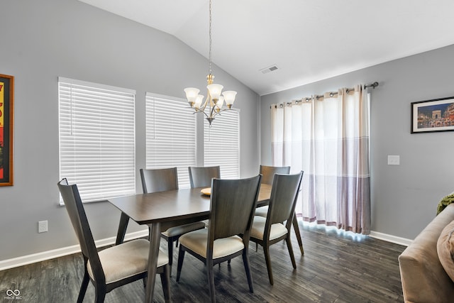 dining area featuring a notable chandelier, lofted ceiling, and dark hardwood / wood-style floors