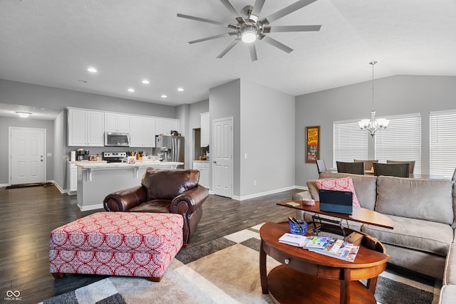 living room with ceiling fan with notable chandelier, dark hardwood / wood-style flooring, and lofted ceiling