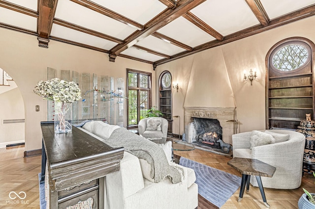 living room featuring a large fireplace, coffered ceiling, beam ceiling, and light parquet floors