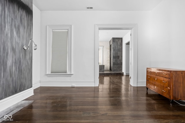 spare room with dark wood-type flooring