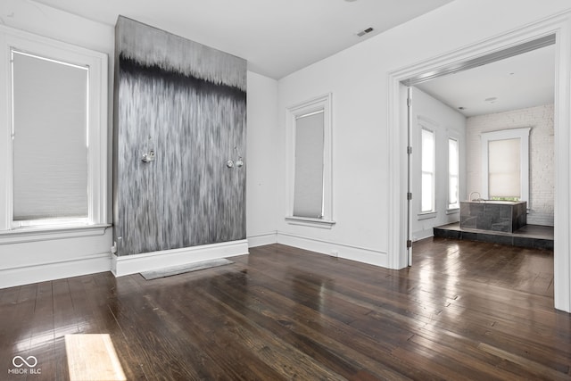 spare room with dark wood-type flooring