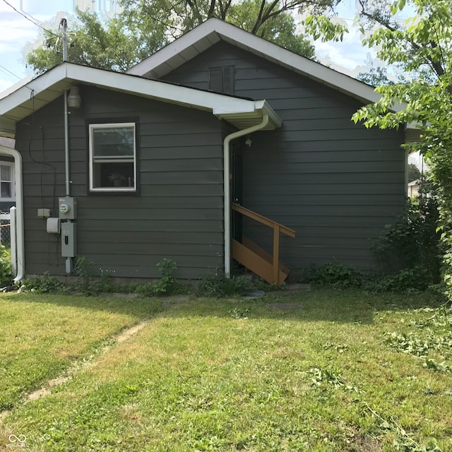 view of home's exterior featuring a lawn