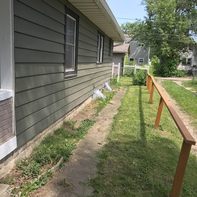 view of property exterior featuring a yard