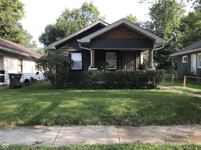 bungalow featuring a front yard