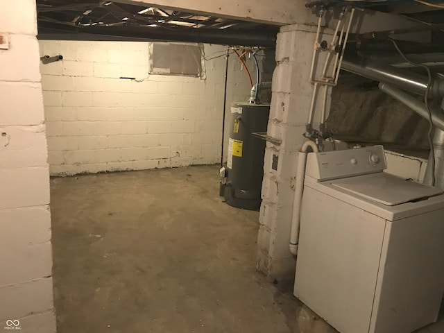 basement with washer / clothes dryer and water heater