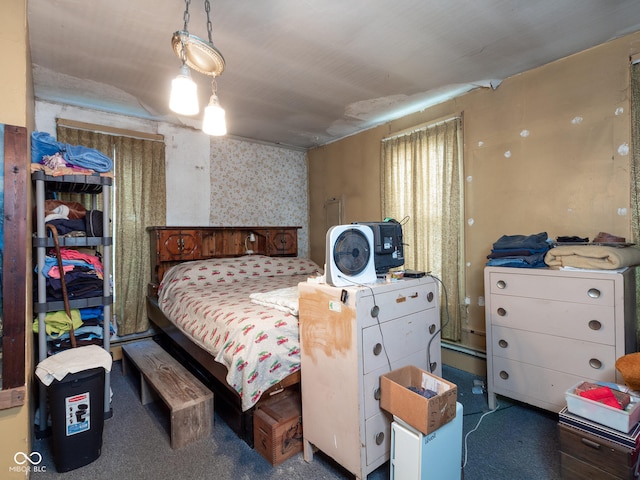 bedroom featuring dark colored carpet