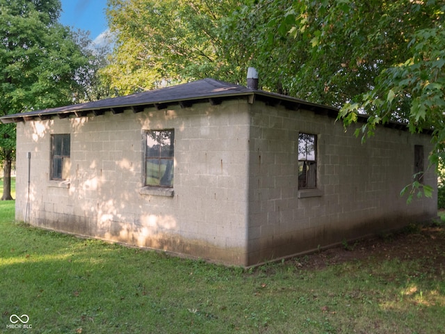 view of home's exterior with a yard