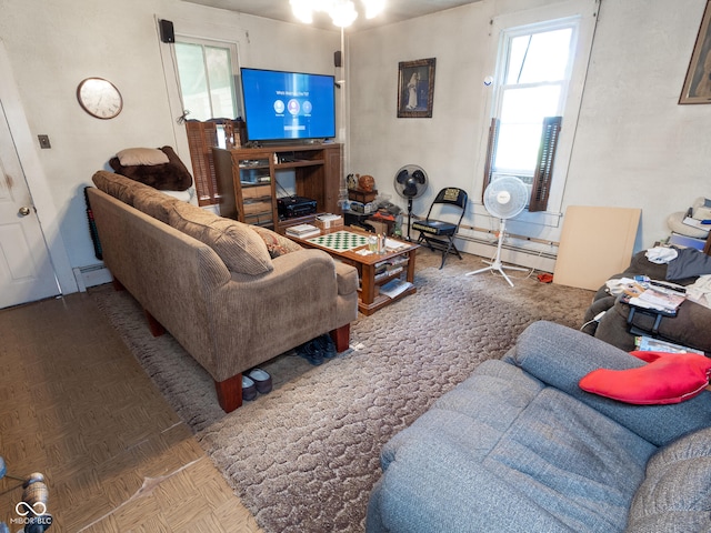 living room with a baseboard heating unit