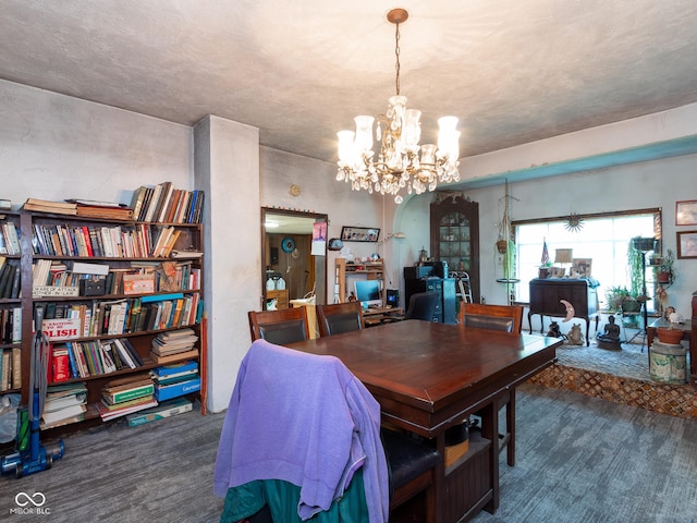 carpeted dining space with a notable chandelier