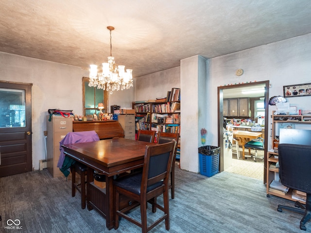 dining area featuring an inviting chandelier and carpet