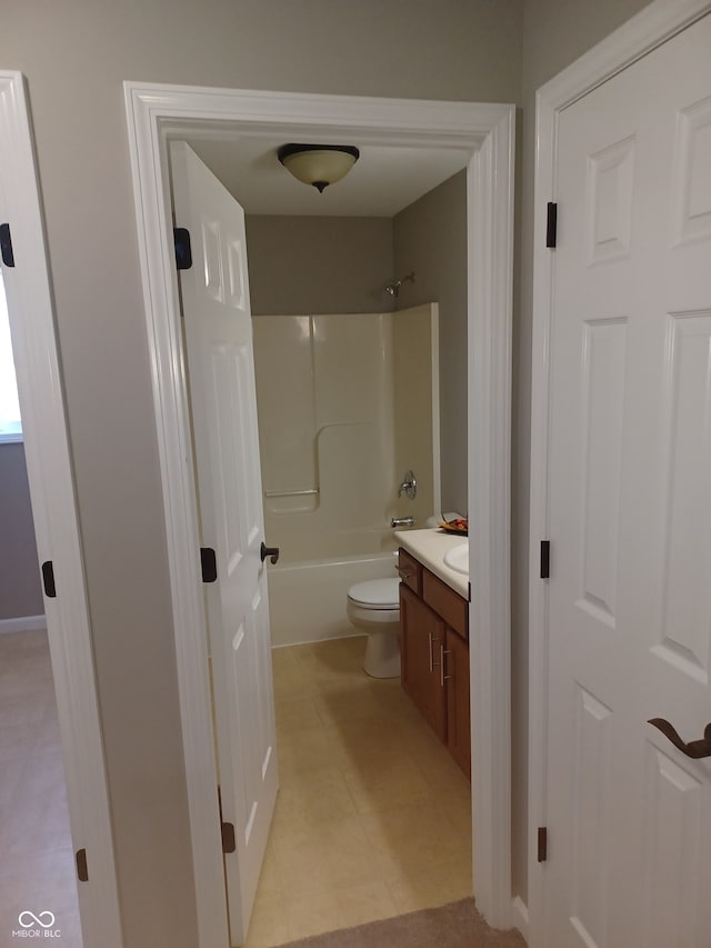 full bathroom featuring toilet, washtub / shower combination, and vanity