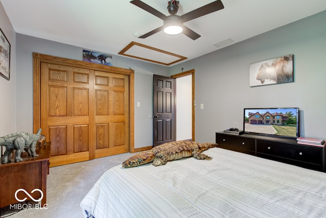 bedroom featuring light colored carpet and ceiling fan