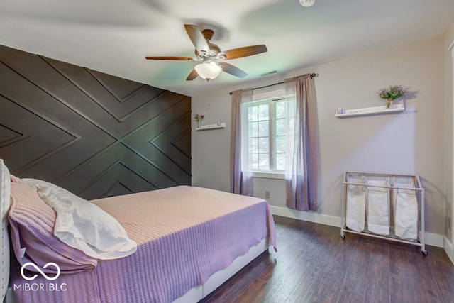 bedroom featuring ceiling fan and dark hardwood / wood-style floors