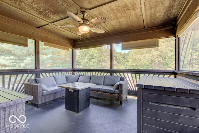 sunroom with wood ceiling and ceiling fan