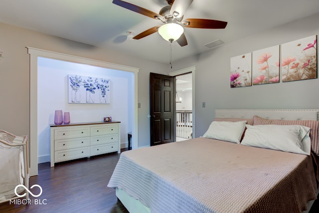 bedroom featuring ceiling fan and dark hardwood / wood-style flooring