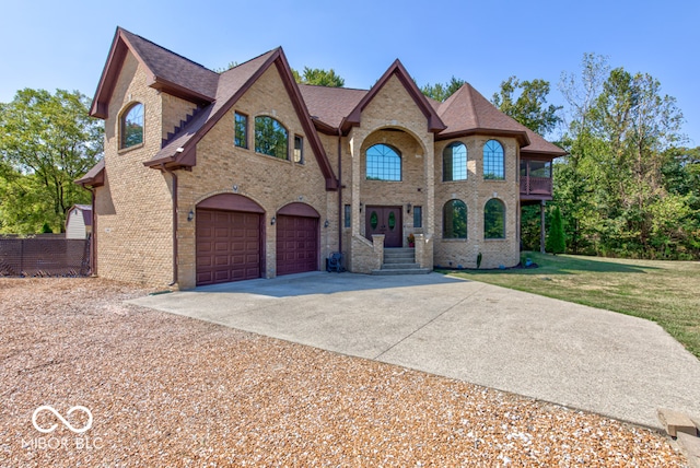 view of front of house with a front lawn and a garage