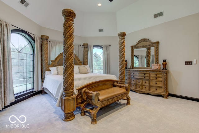 carpeted bedroom featuring multiple windows